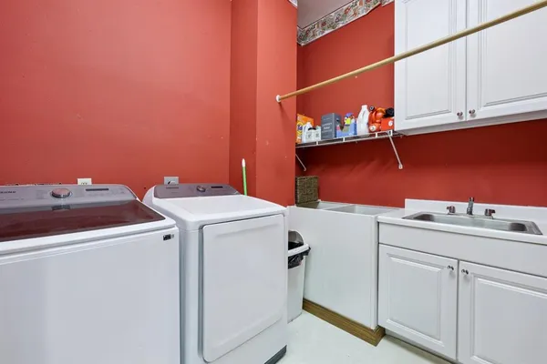 a view of a hallway with a door and stairs