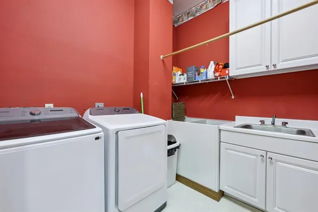 a view of a hallway with a door and stairs