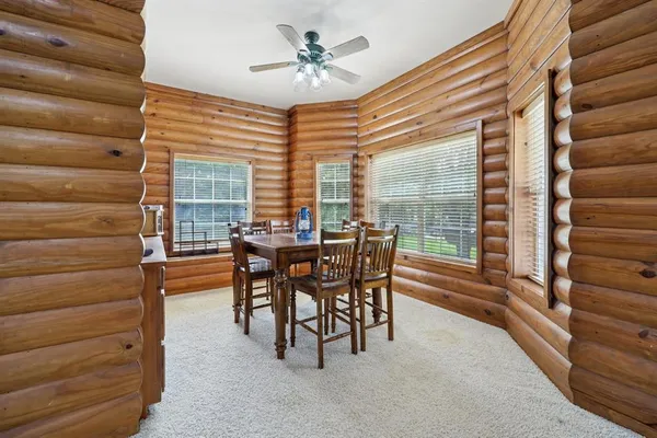 a view of a livingroom with furniture and windows