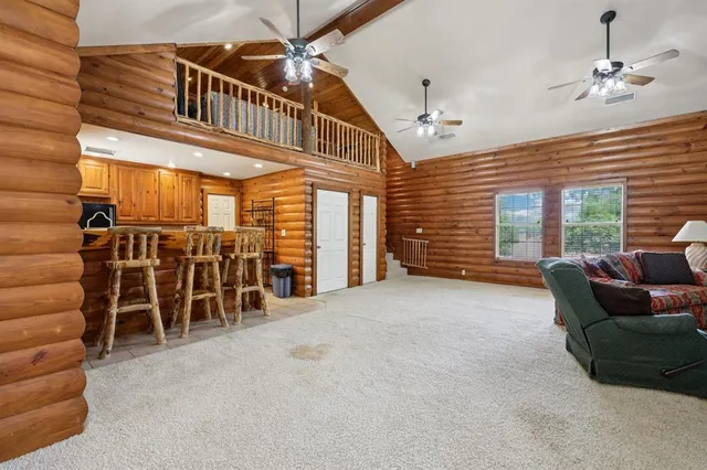 a view of a kitchen with furniture and cabinets