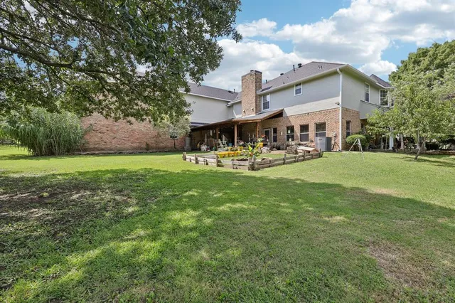 a view of a park with large trees