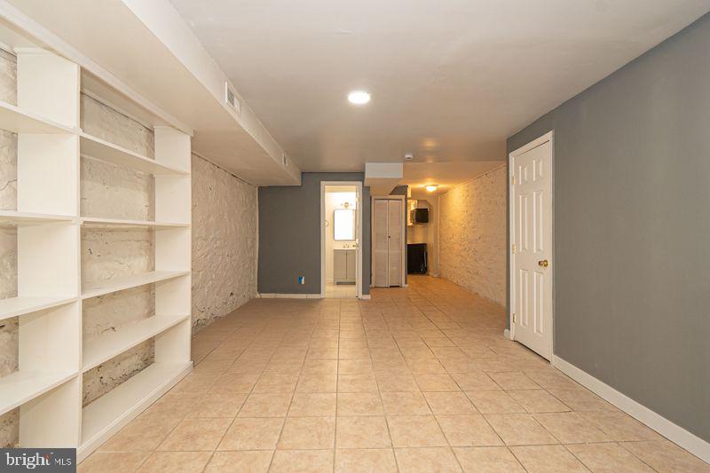 307 East 25th Street, Unit BASEMENT APARTMENT Baltimore, MD 21218 - Photo 9 of 21 a view of an empty room with a window