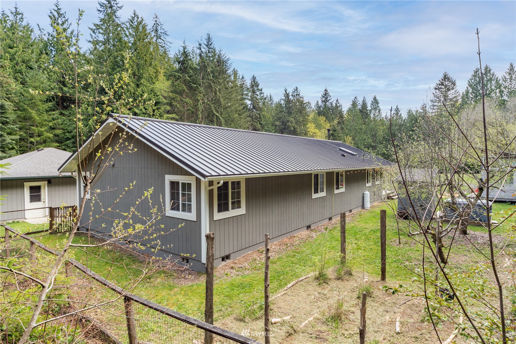 2310 West Valley Road Chimacum, WA 98325 - Photo 11 of 40 a front view of a house with garden