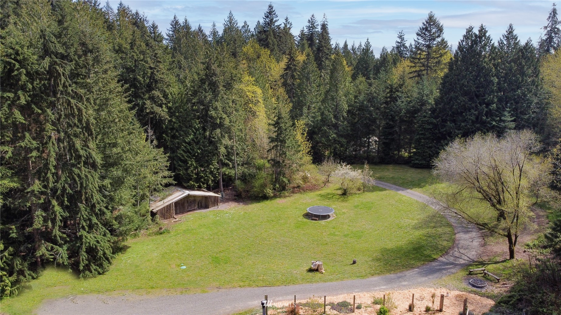 2310 West Valley Road Chimacum, WA 98325 - Photo 13 of 40 a view of a garden with a house