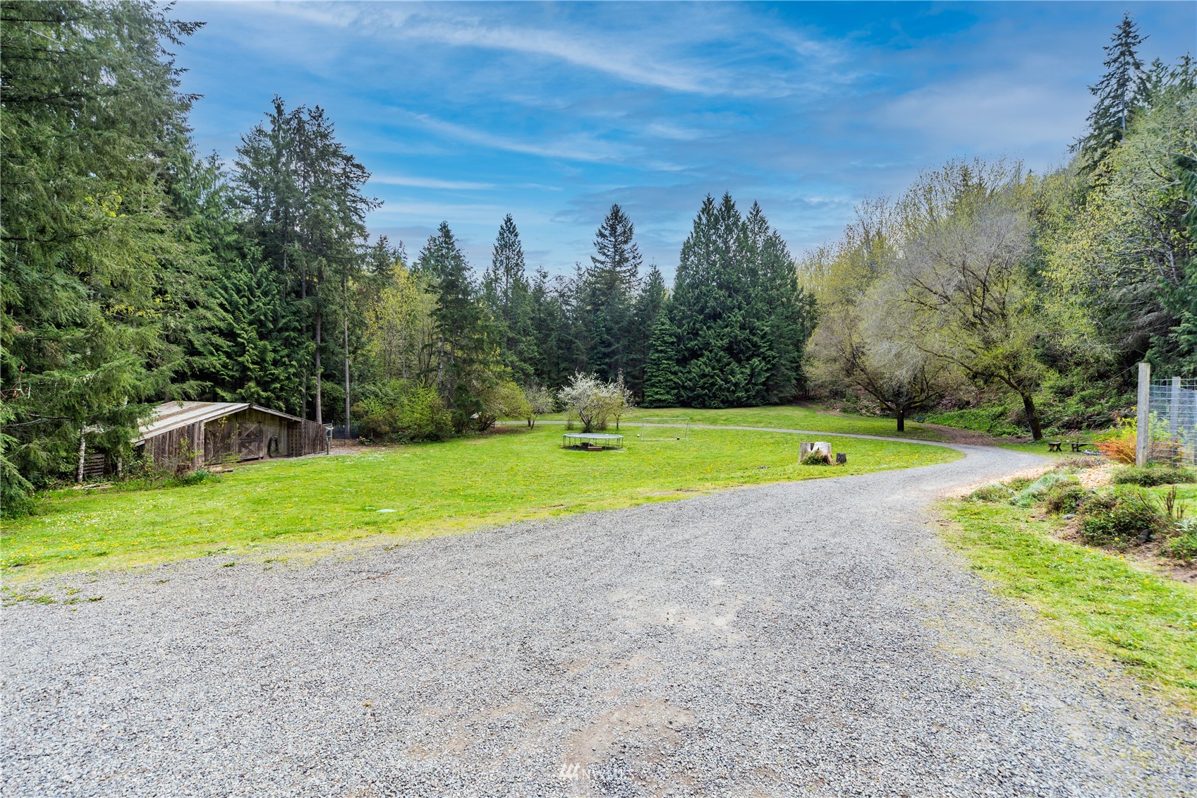 2310 West Valley Road Chimacum, WA 98325 - Photo 14 of 40 a view of a swimming pool with a yard