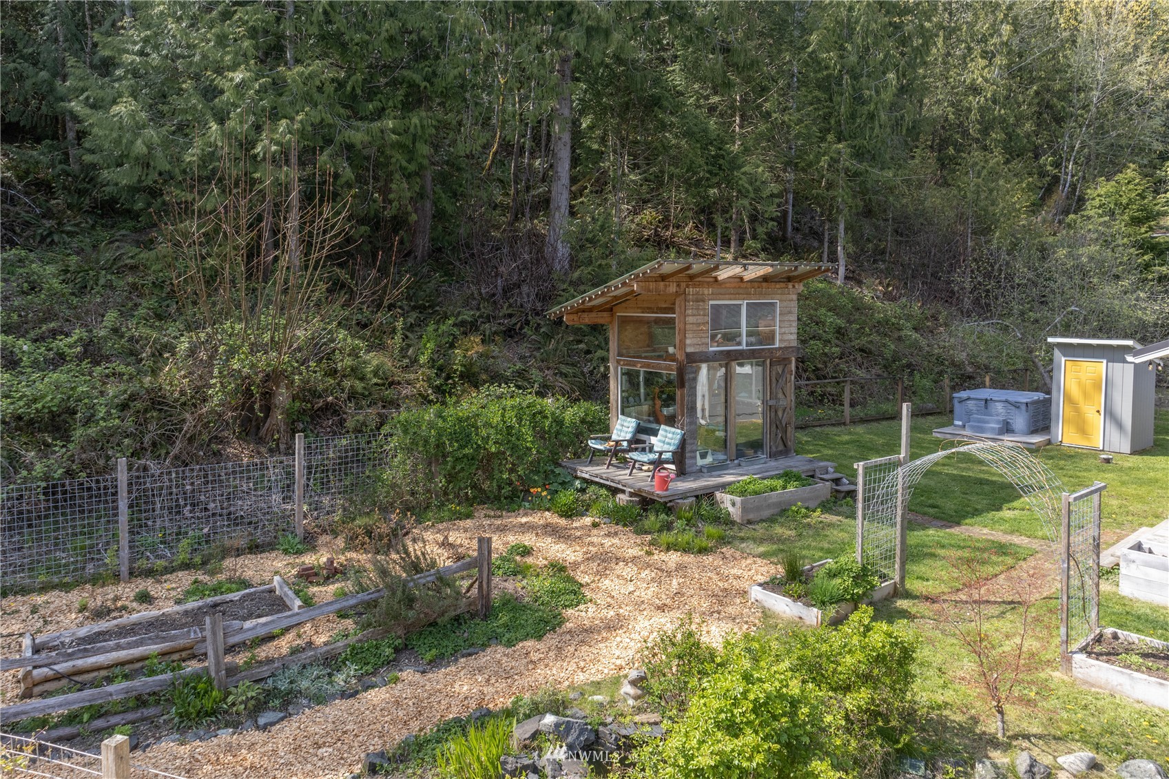 2310 West Valley Road Chimacum, WA 98325 - Photo 15 of 40 a view of a house with backyard and sitting area