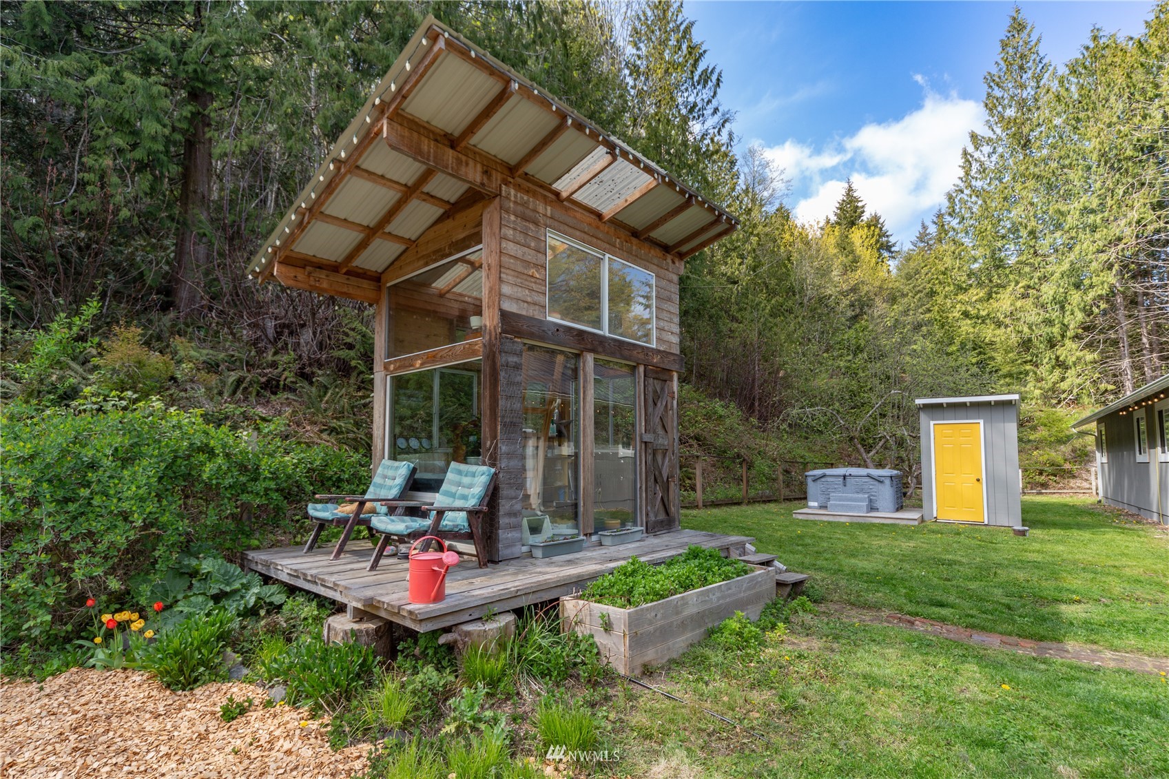2310 West Valley Road Chimacum, WA 98325 - Photo 16 of 40 a backyard of a house with yard and outdoor seating