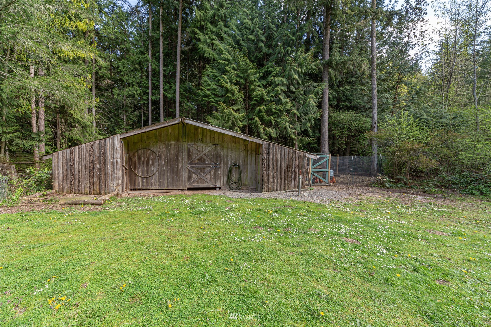 2310 West Valley Road Chimacum, WA 98325 - Photo 19 of 40 a backyard of a house with lots of green space