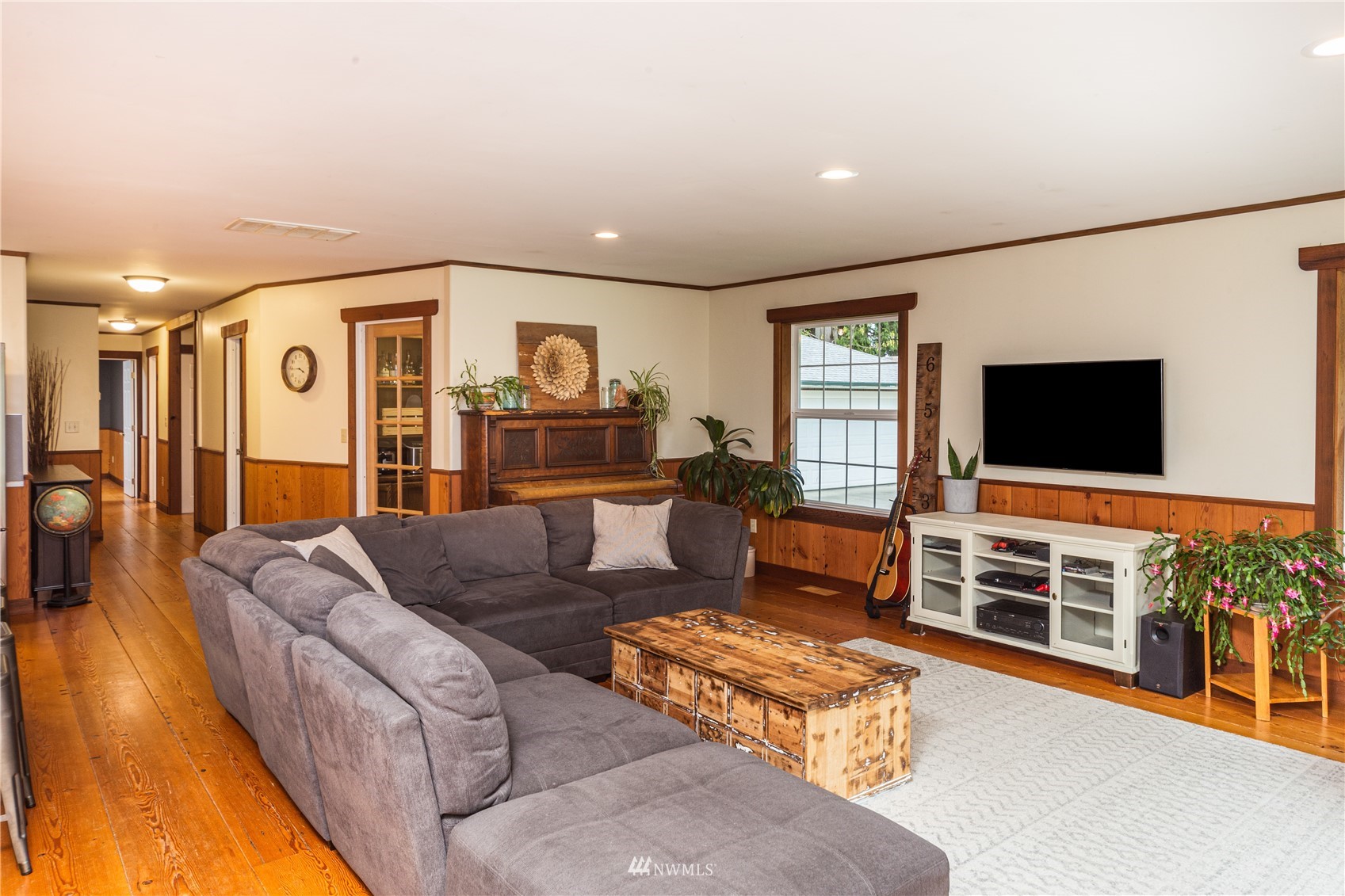 2310 West Valley Road Chimacum, WA 98325 - Photo 23 of 40 a living room with furniture and a flat screen tv