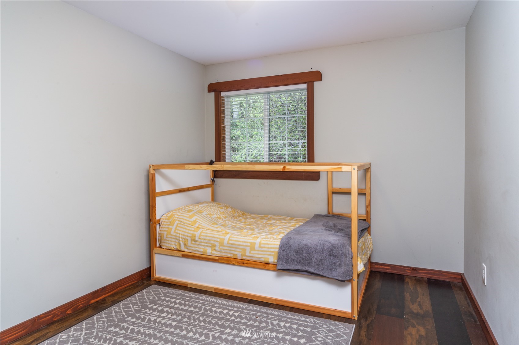 2310 West Valley Road Chimacum, WA 98325 - Photo 37 of 40 a bedroom with a bed and wooden floor