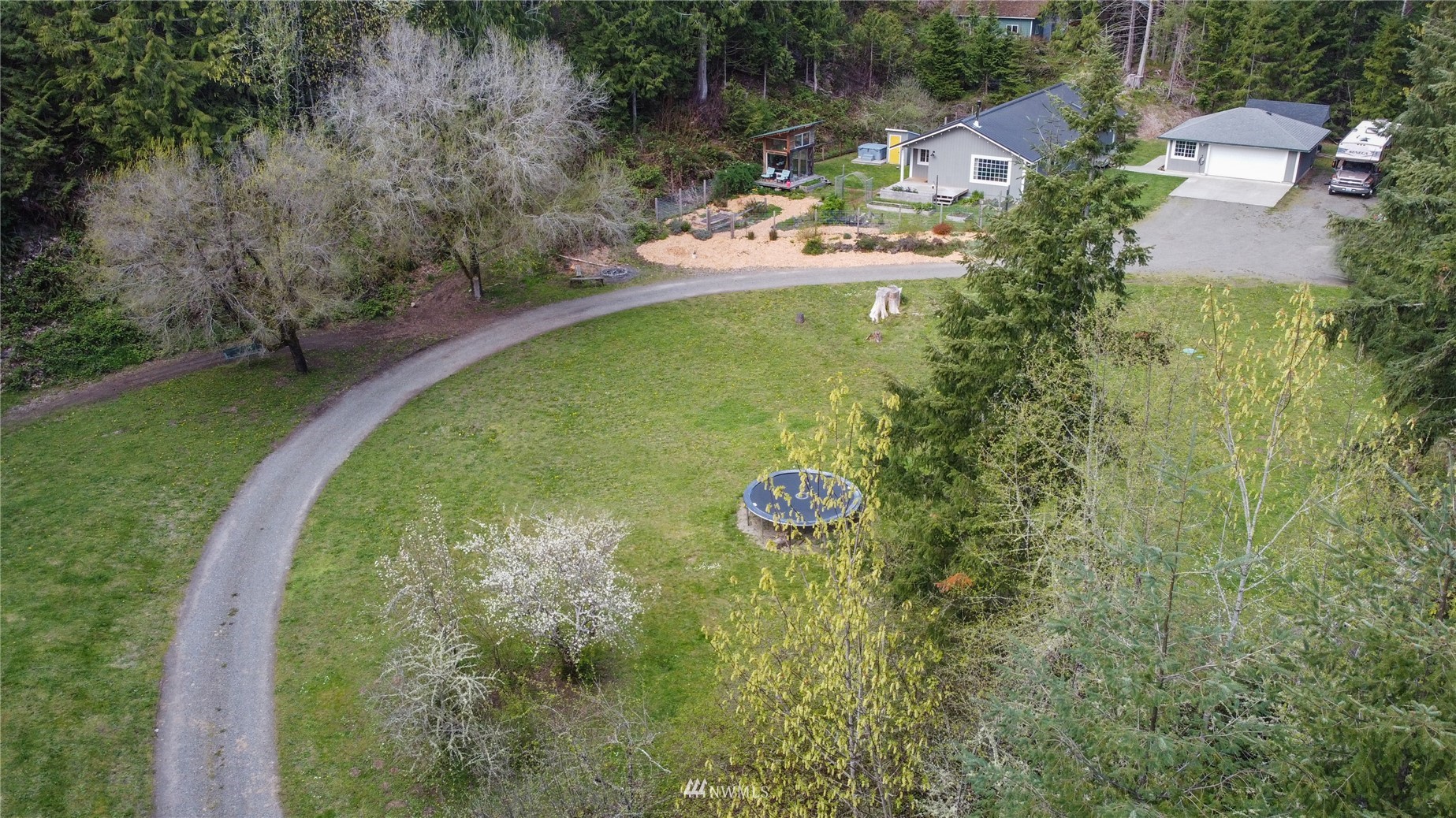 2310 West Valley Road Chimacum, WA 98325 - Photo 5 of 40 an aerial view of a house with outdoor space and trees all around