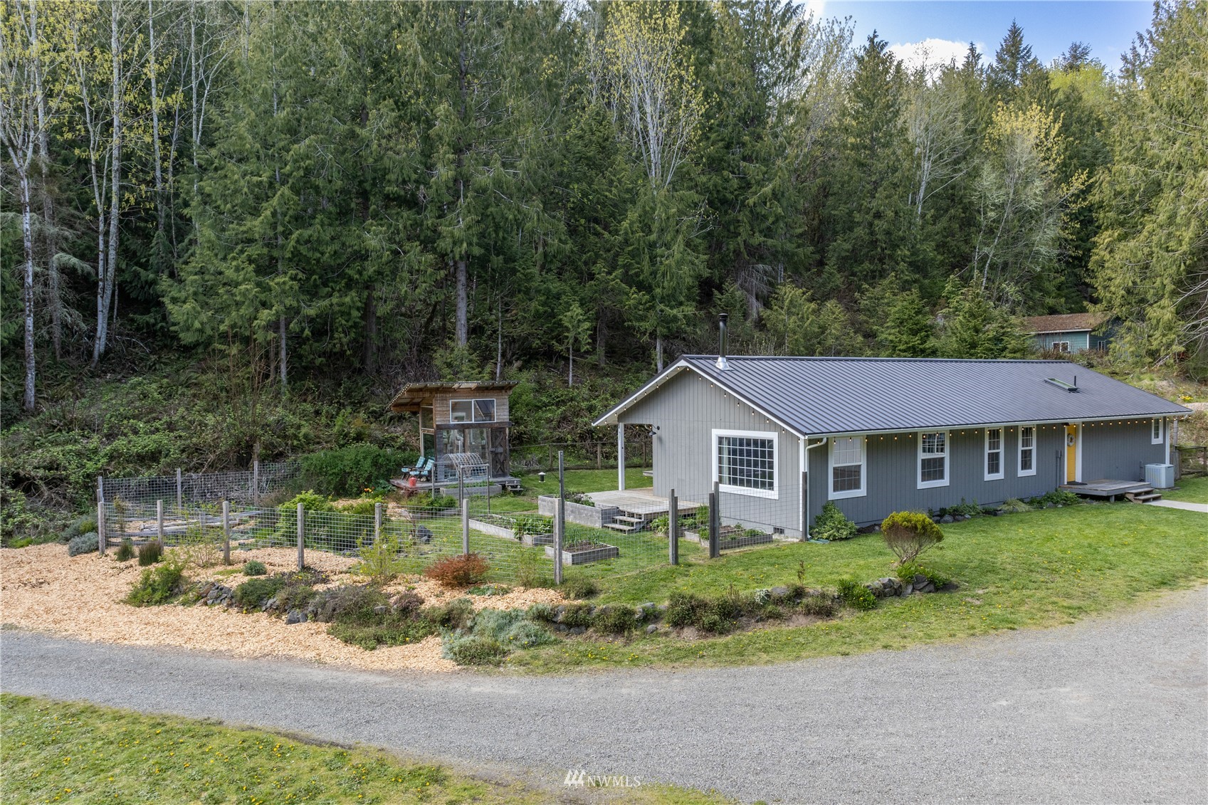 2310 West Valley Road Chimacum, WA 98325 - Photo 7 of 40 a front view of a house with garden