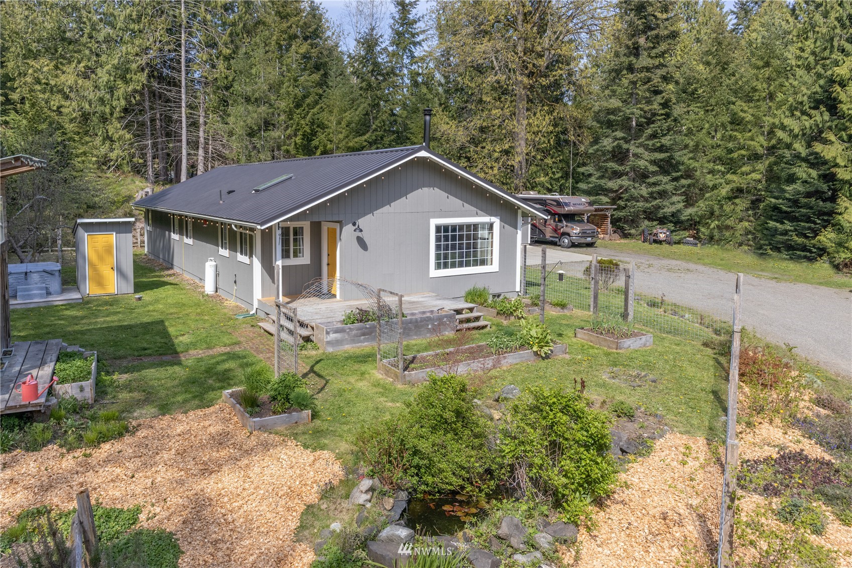 2310 West Valley Road Chimacum, WA 98325 - Photo 8 of 40 a house view with a garden space
