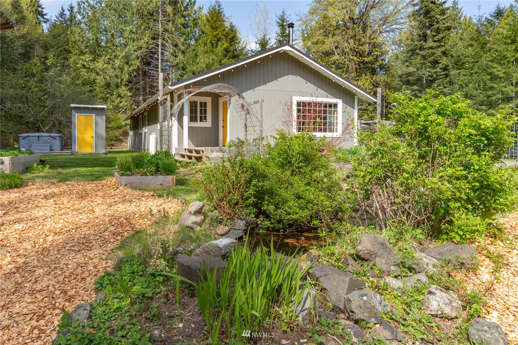 2310 West Valley Road Chimacum, WA 98325 - Photo 9 of 40 a view of a house with a yard and plants