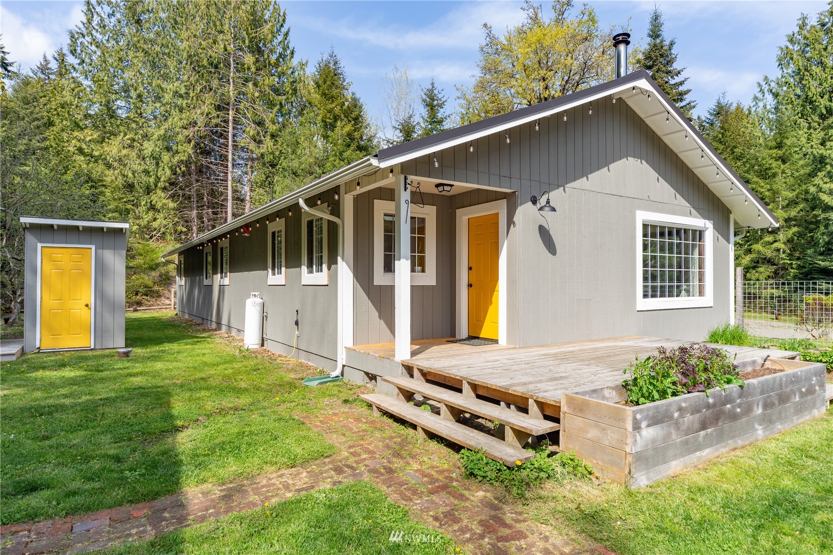 2310 West Valley Road Chimacum, WA 98325 - Photo 10 of 40 a front view of a house with a yard