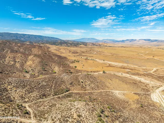 a view of mountain view with mountains in the background
