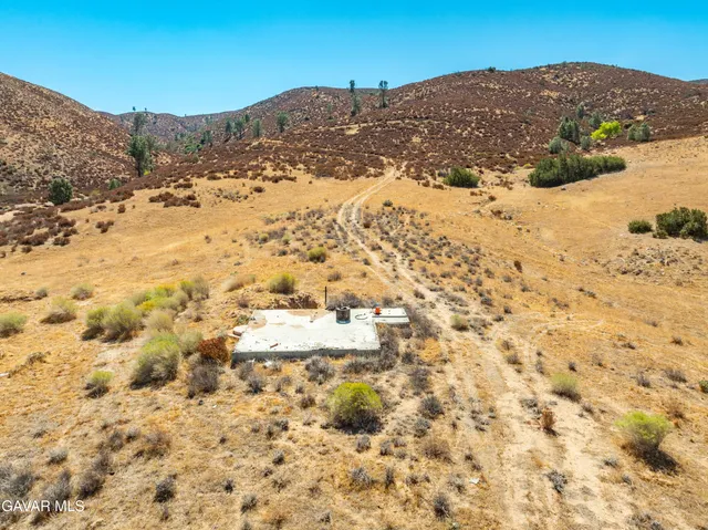 a view of mountain view with mountains in the background