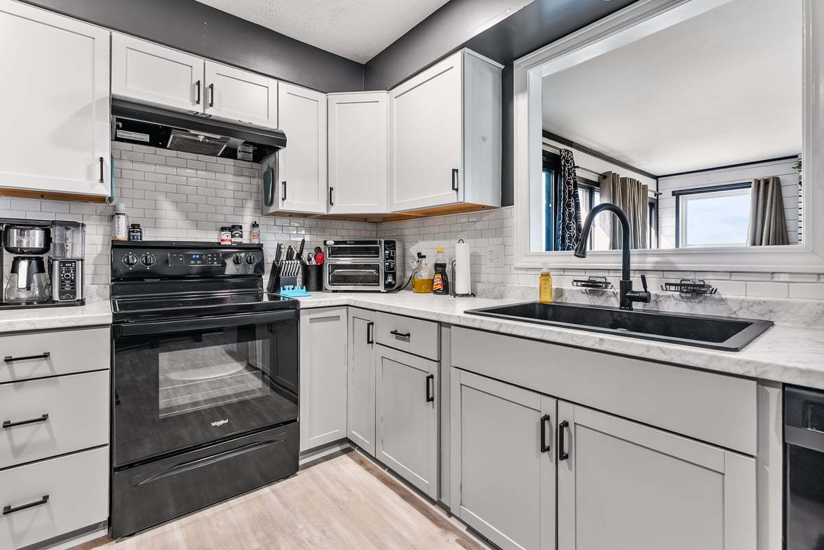 208 East 8th Street Gridley, IL 61744 - Photo 8 of 20 a kitchen with a sink and cabinets