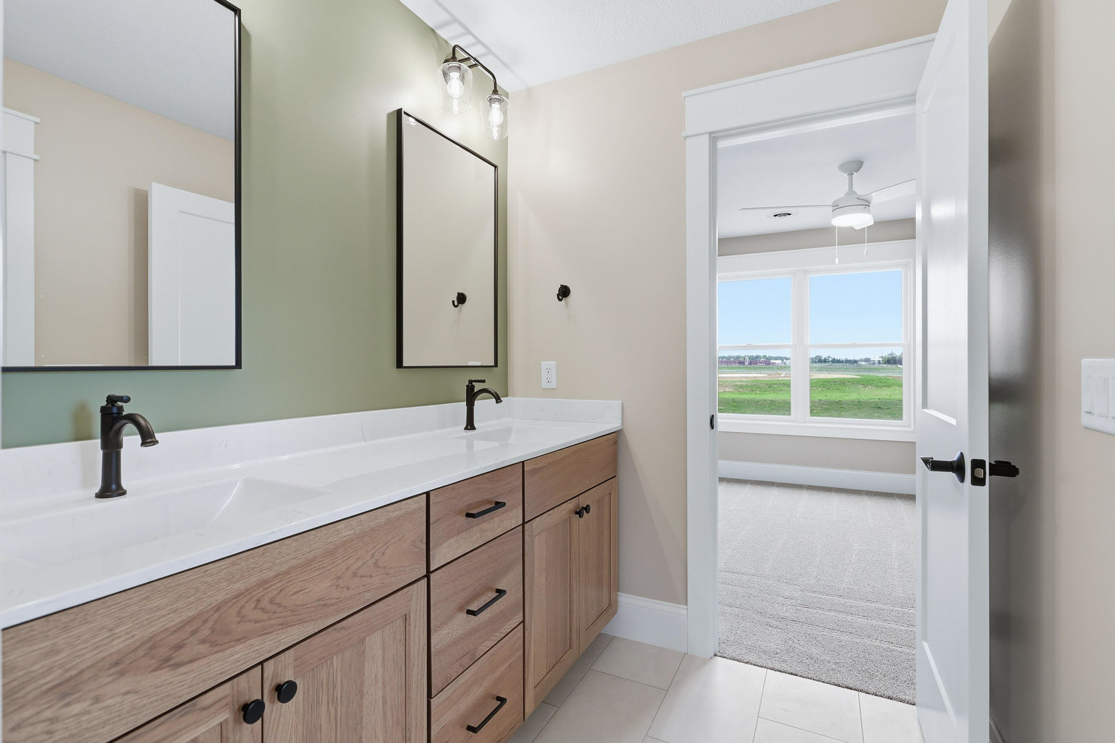 6928 Wilderness Pointe Bettendorf, IA 52722 - Photo 37 of 48 a bathroom with a double vanity sink and mirror