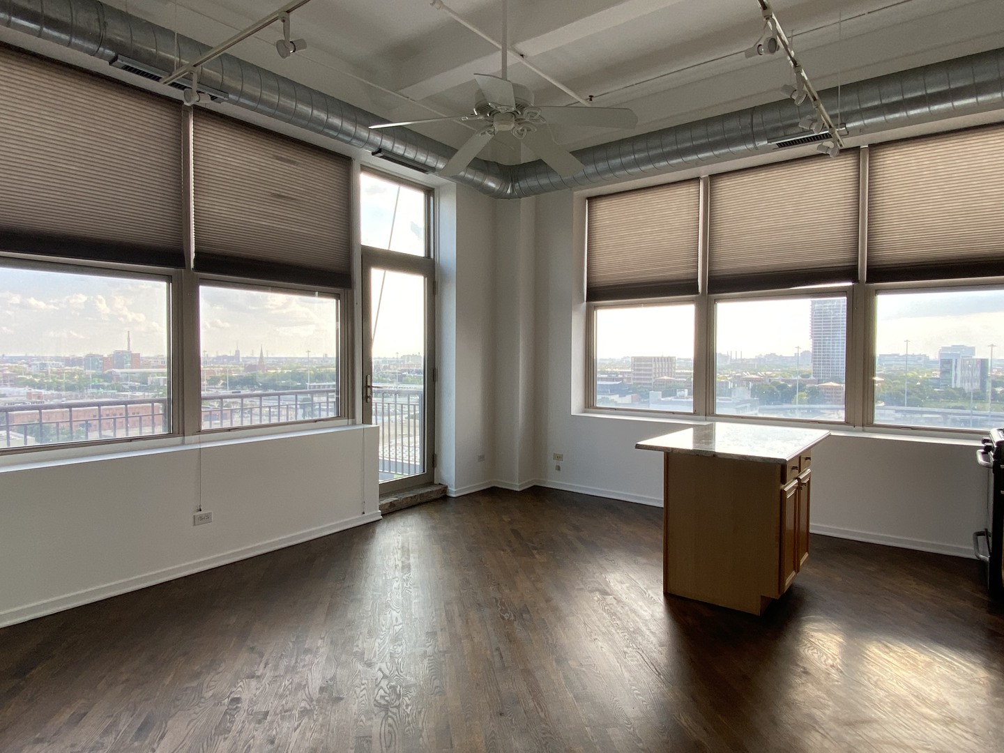 500 South Clinton Street, Unit 1017 Chicago, IL 60607 - Photo 7 of 12 a room with wooden floor and furniture