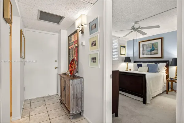 a kitchen with a refrigerator and cabinets