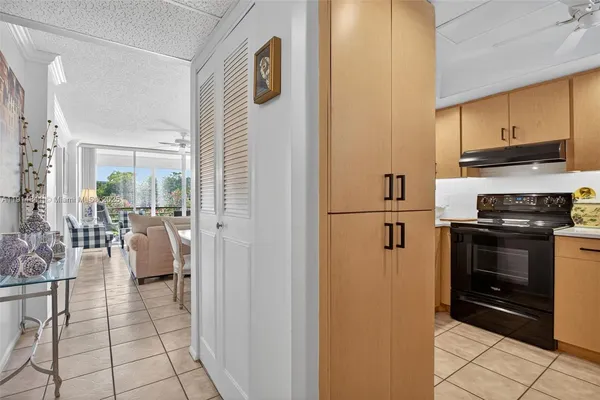 a kitchen with a sink a stove and refrigerator