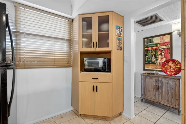 a kitchen with stainless steel appliances a sink a stove and a refrigerator