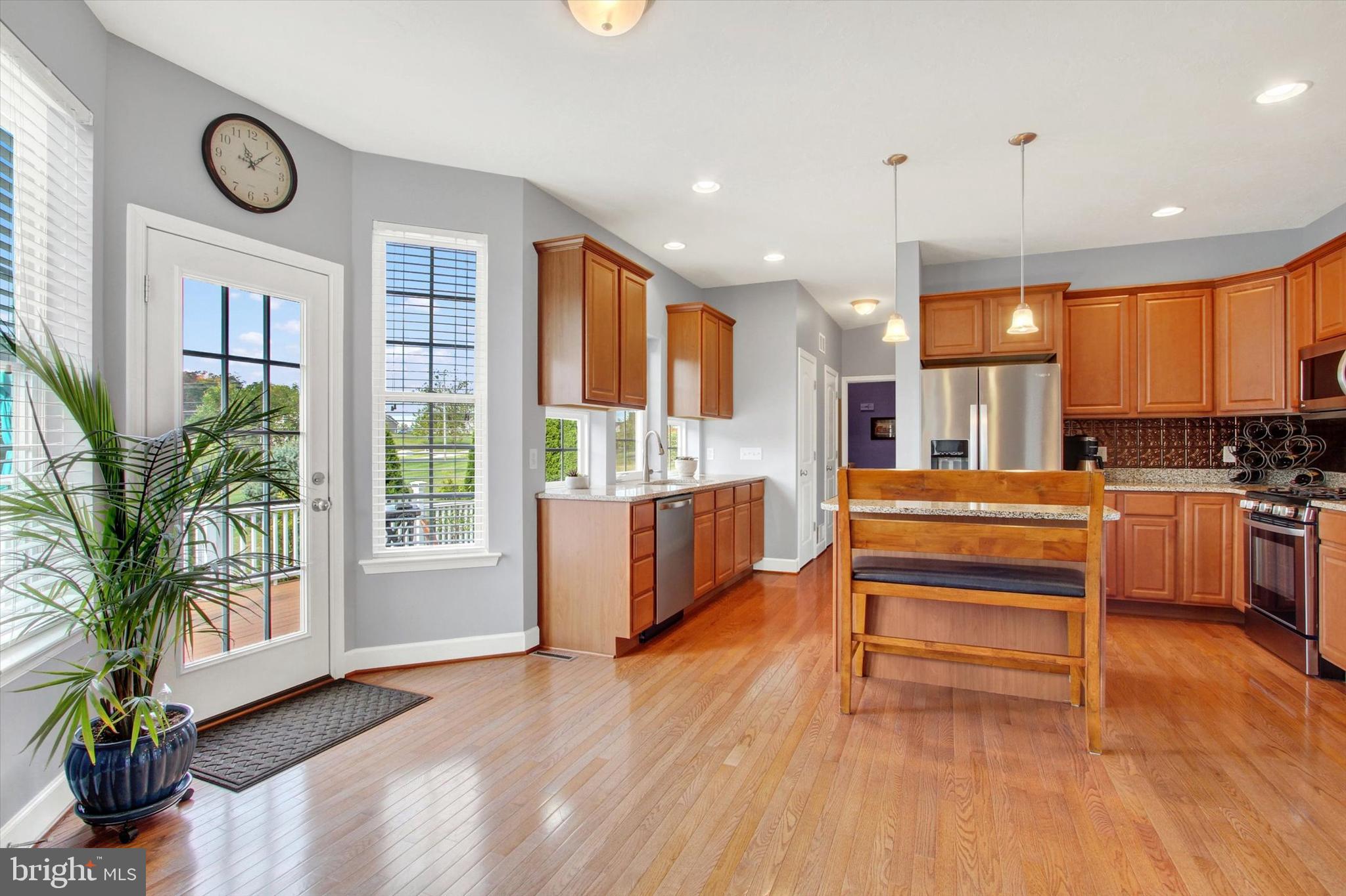 118 Fairplay Road Gettysburg, PA 17325 - Photo 14 of 43 a view of kitchen with stainless steel appliances granite countertop a stove and a wooden floors