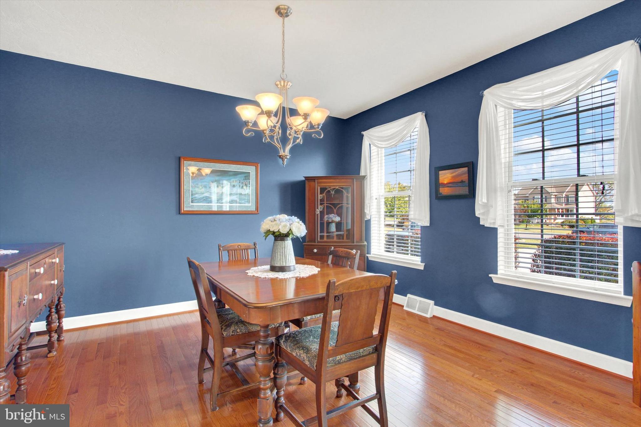 118 Fairplay Road Gettysburg, PA 17325 - Photo 10 of 43 a view of a dining room with furniture a chandelier and wooden floor