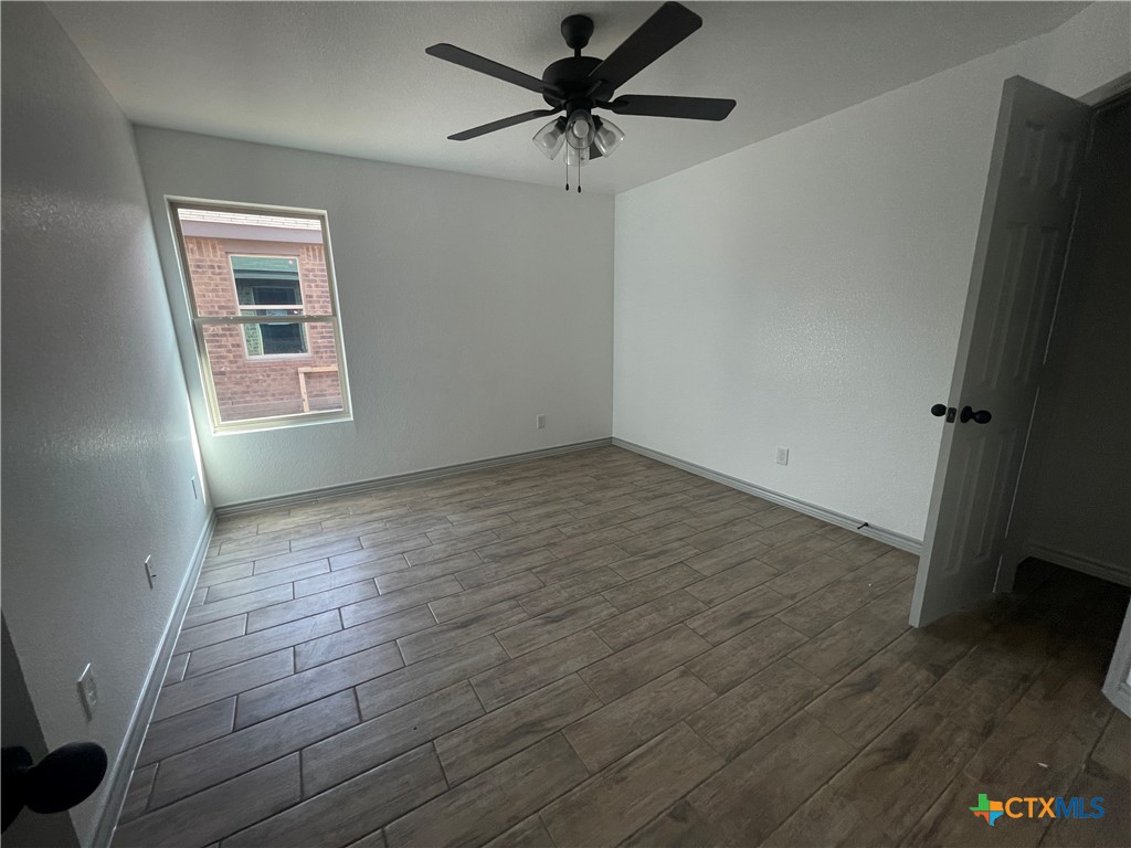 2408 Duntov Drive Temple, TX 76504 - Photo 29 of 41 wooden floor in an empty room with a window