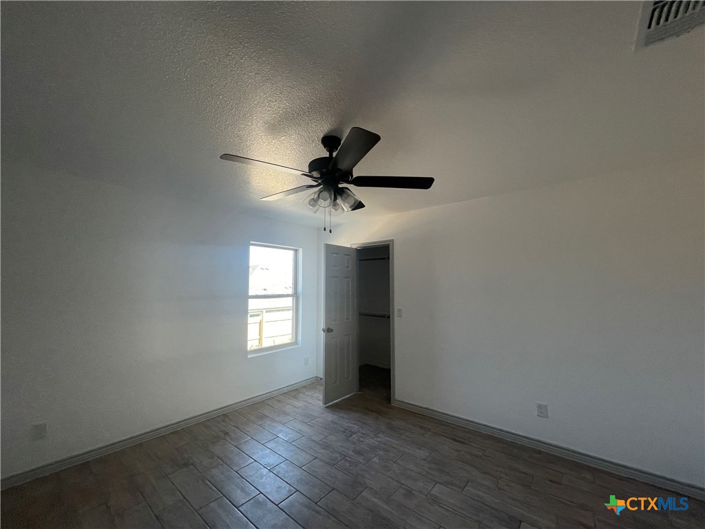 2408 Duntov Drive Temple, TX 76504 - Photo 30 of 41 a view of an empty room with wooden floor and a window