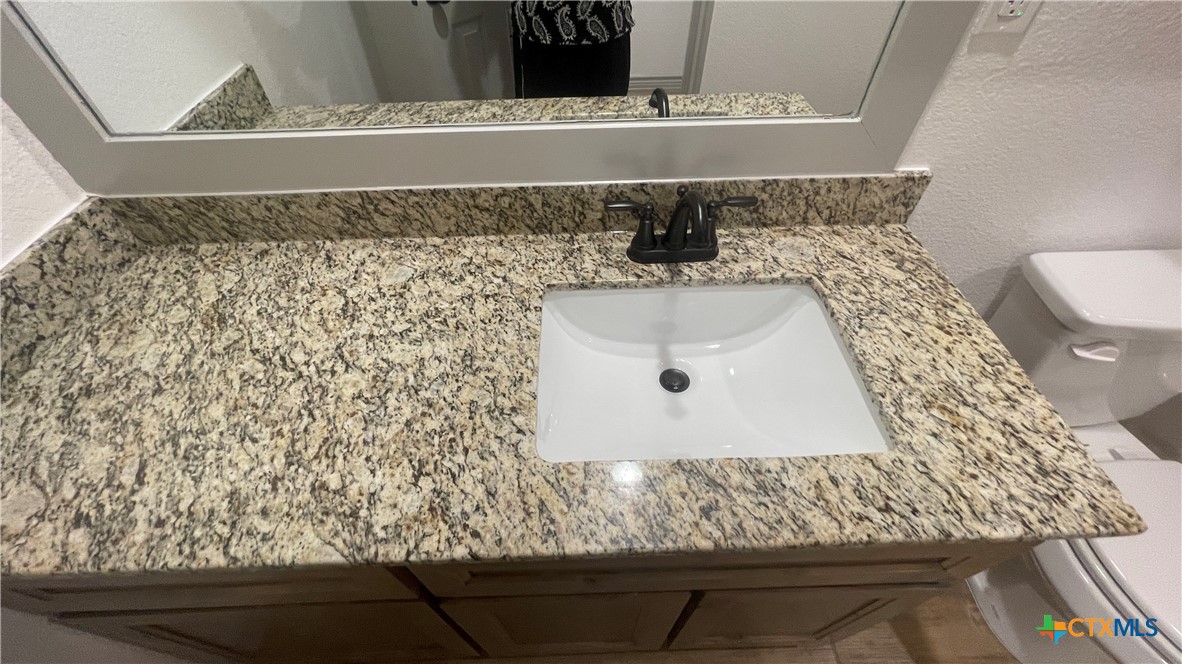 2408 Duntov Drive Temple, TX 76504 - Photo 34 of 41 a bathroom with a sink and mirror