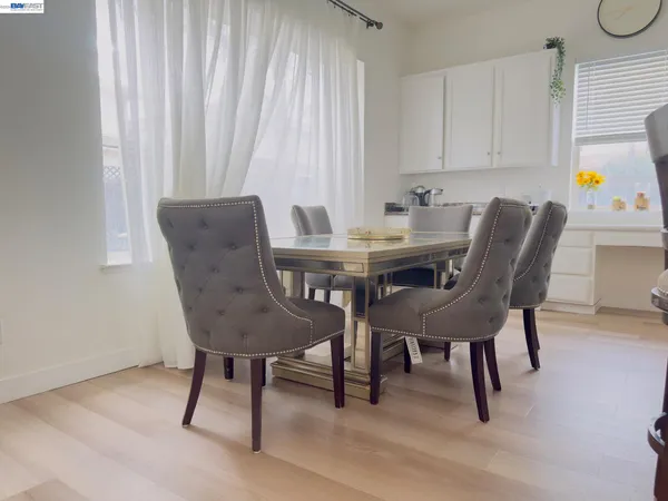 a view of a dining room with furniture and a window