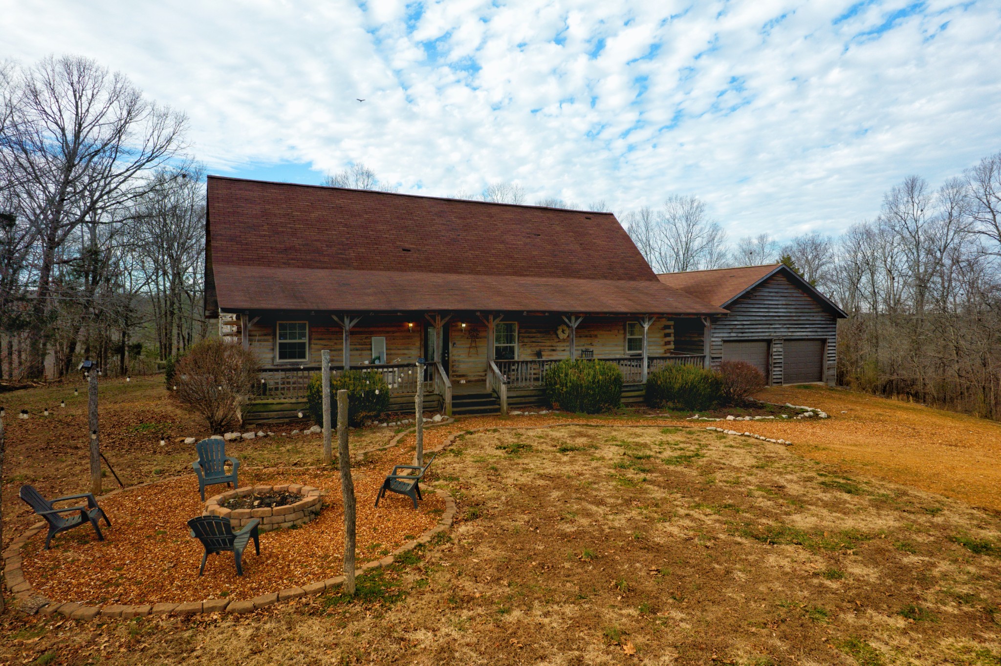 6843 Rabbit Creek Road Buchanan, TN 38222 - Photo 1 of 61 a backyard of a house with table and chairs