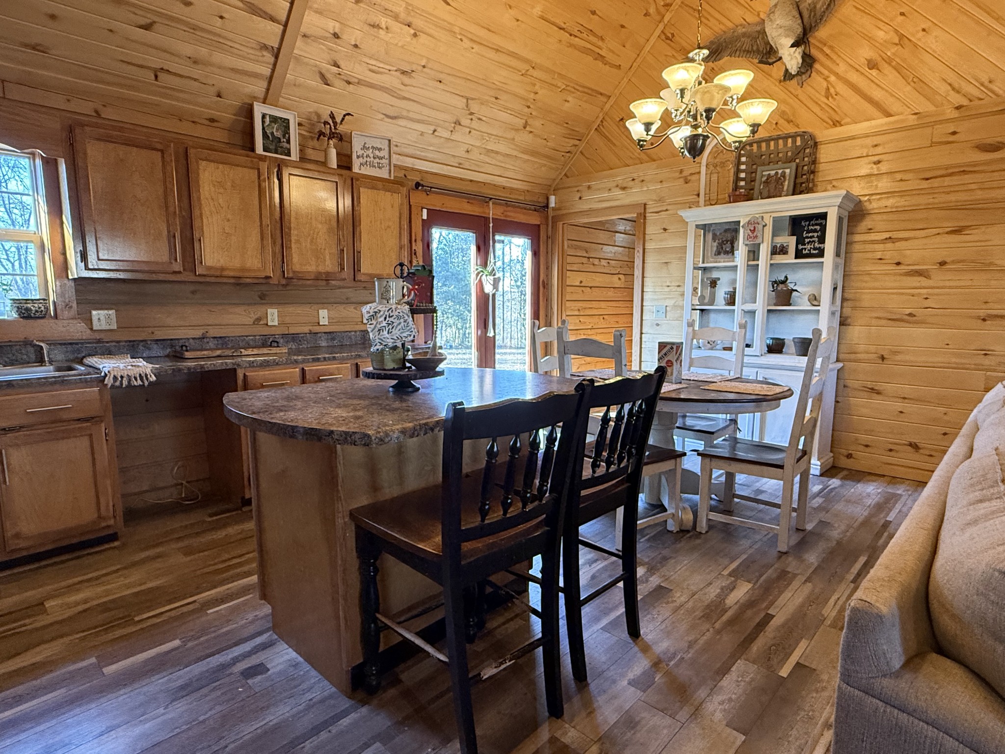 6843 Rabbit Creek Road Buchanan, TN 38222 - Photo 15 of 61 a view of a dining room with furniture window and wooden floor