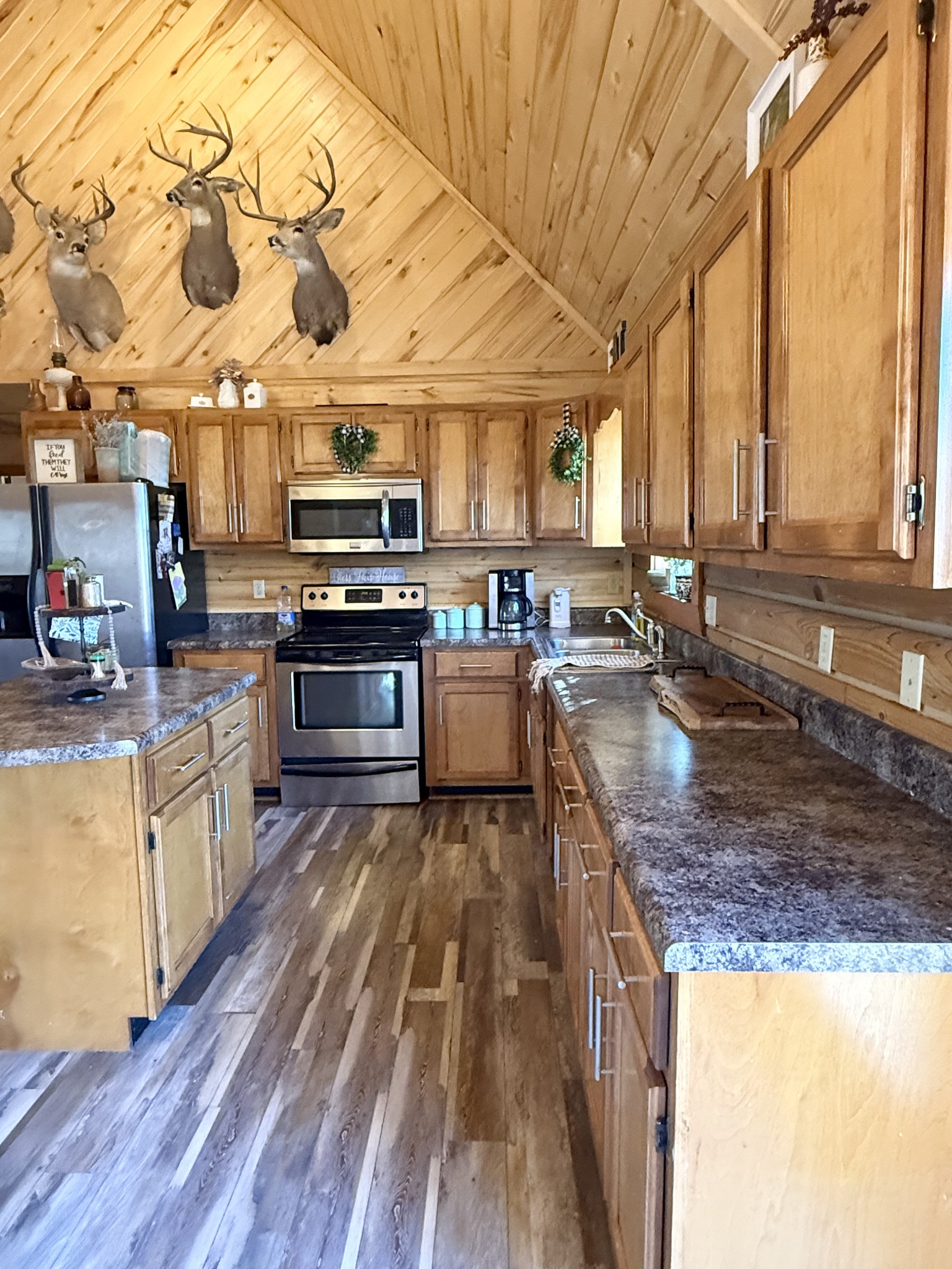6843 Rabbit Creek Road Buchanan, TN 38222 - Photo 18 of 61 a kitchen with stainless steel appliances granite countertop a stove a sink and a microwave