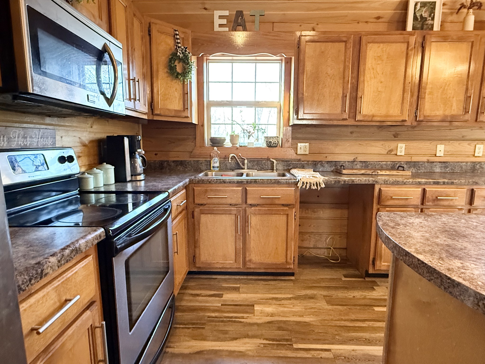 6843 Rabbit Creek Road Buchanan, TN 38222 - Photo 20 of 61 a kitchen with a sink stove and cabinets