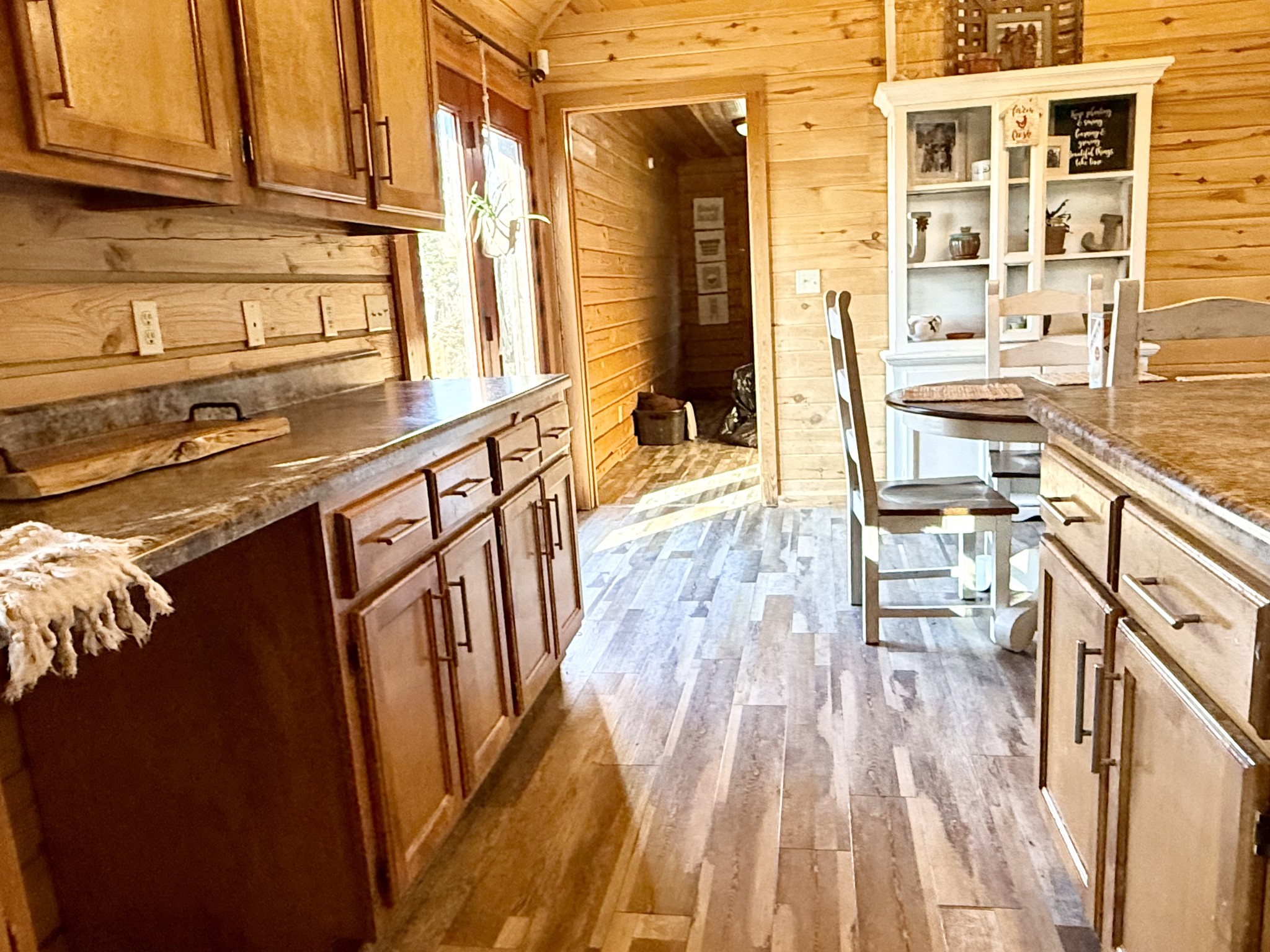 6843 Rabbit Creek Road Buchanan, TN 38222 - Photo 21 of 61 a open kitchen with granite countertop a sink dishwasher stove and wooden cabinets