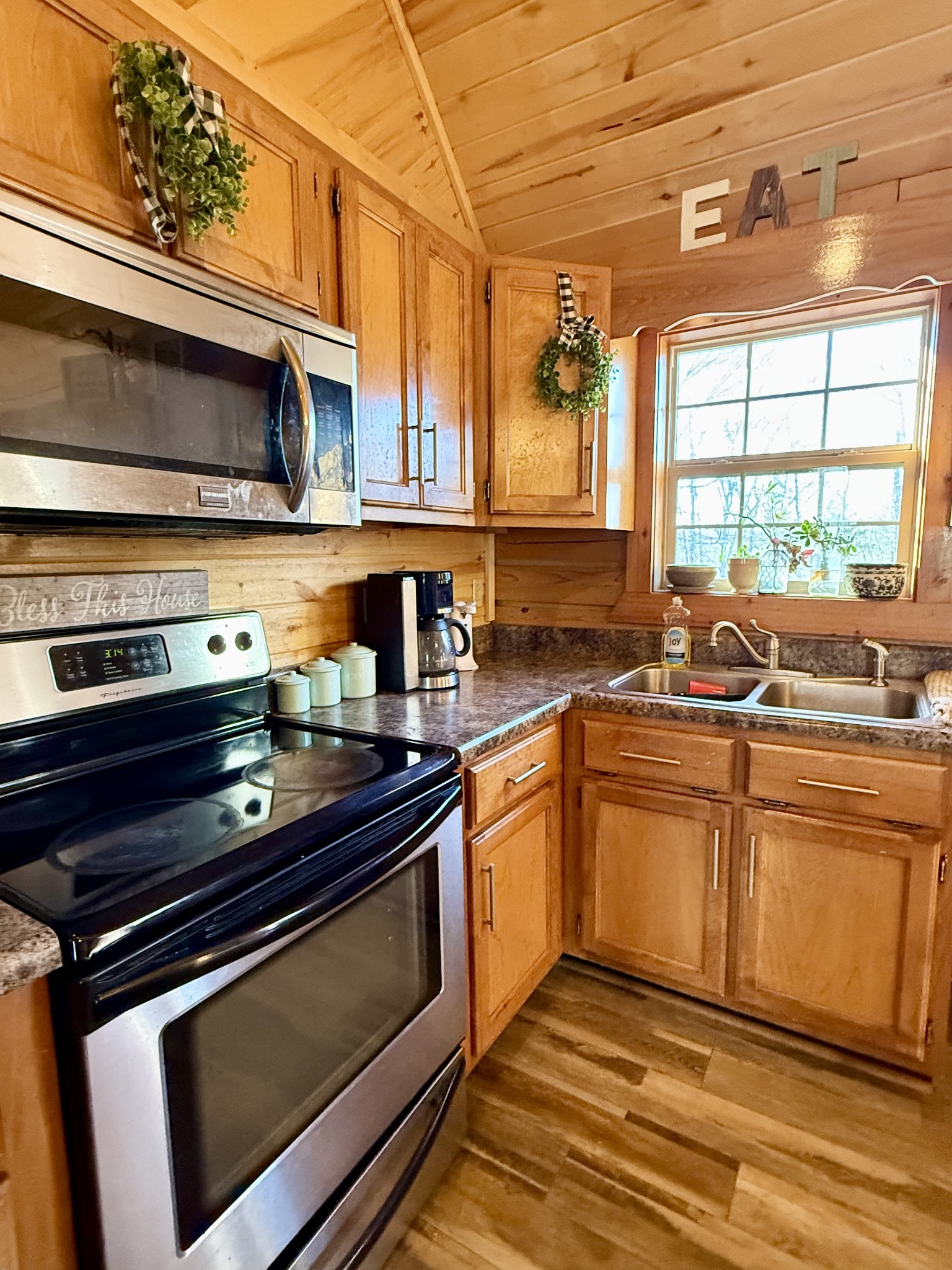 6843 Rabbit Creek Road Buchanan, TN 38222 - Photo 22 of 61 a kitchen with stainless steel appliances a stove sink and cabinets