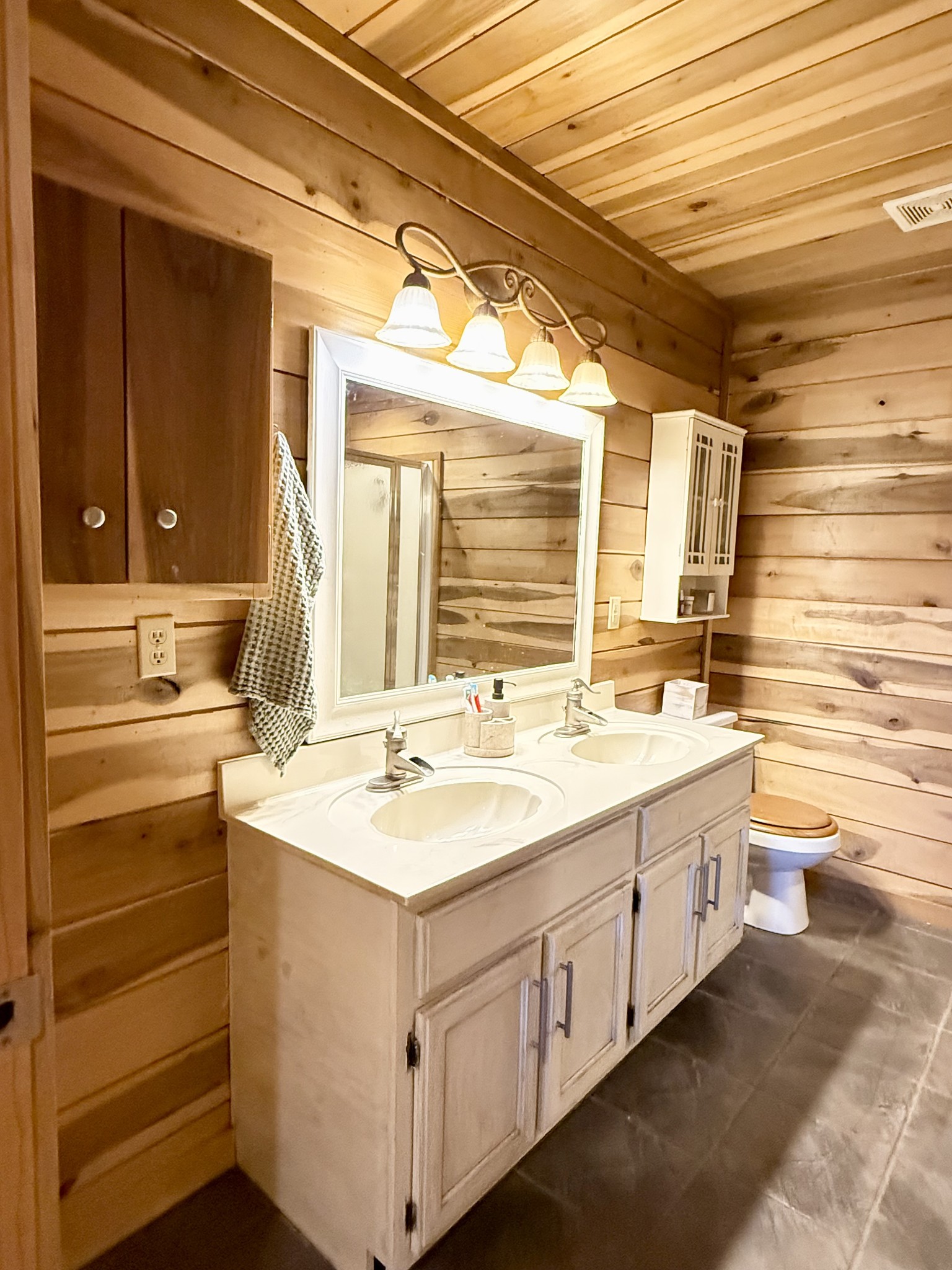 6843 Rabbit Creek Road Buchanan, TN 38222 - Photo 27 of 61 a bathroom with a double vanity sink and a window