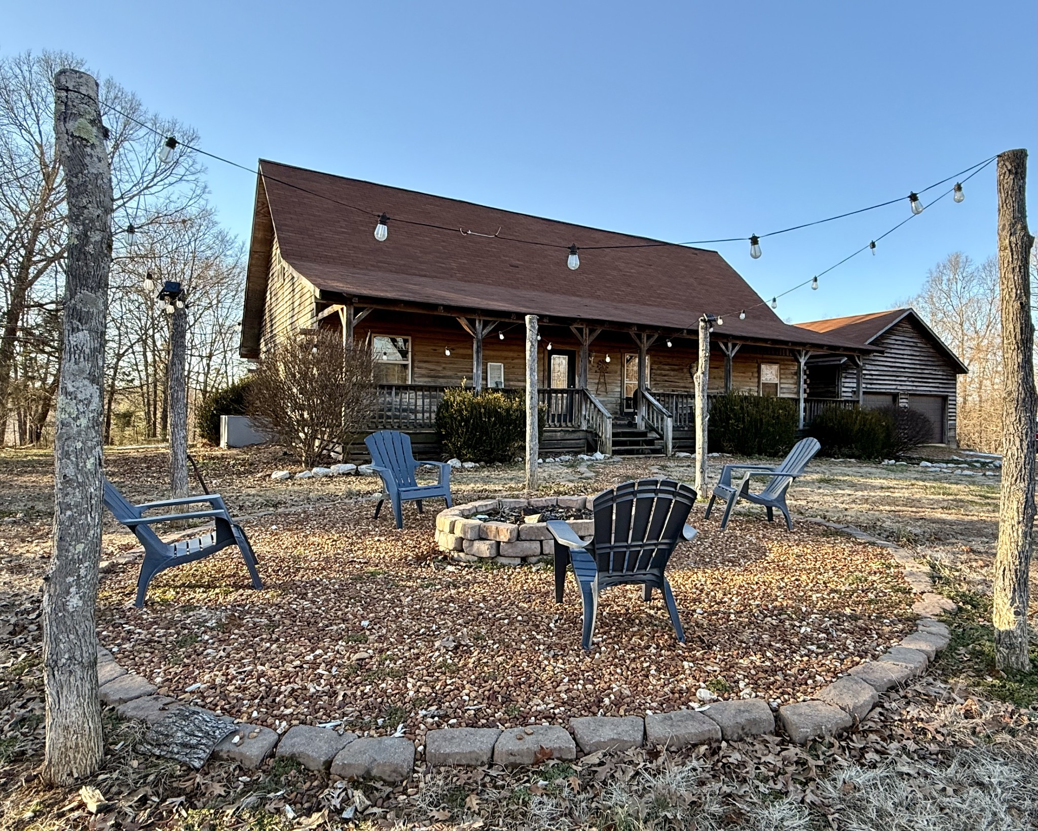 6843 Rabbit Creek Road Buchanan, TN 38222 - Photo 3 of 61 a backyard of a house with garden barbeque oven and outdoor seating