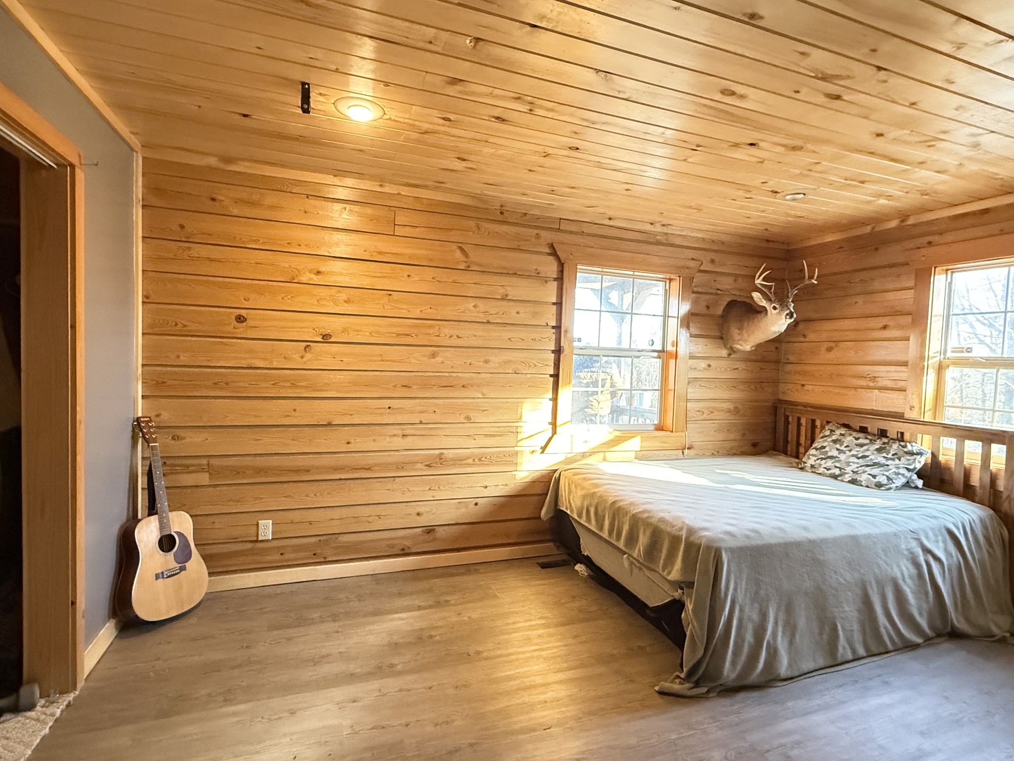 6843 Rabbit Creek Road Buchanan, TN 38222 - Photo 32 of 61 a bedroom with a bed and wooden floor