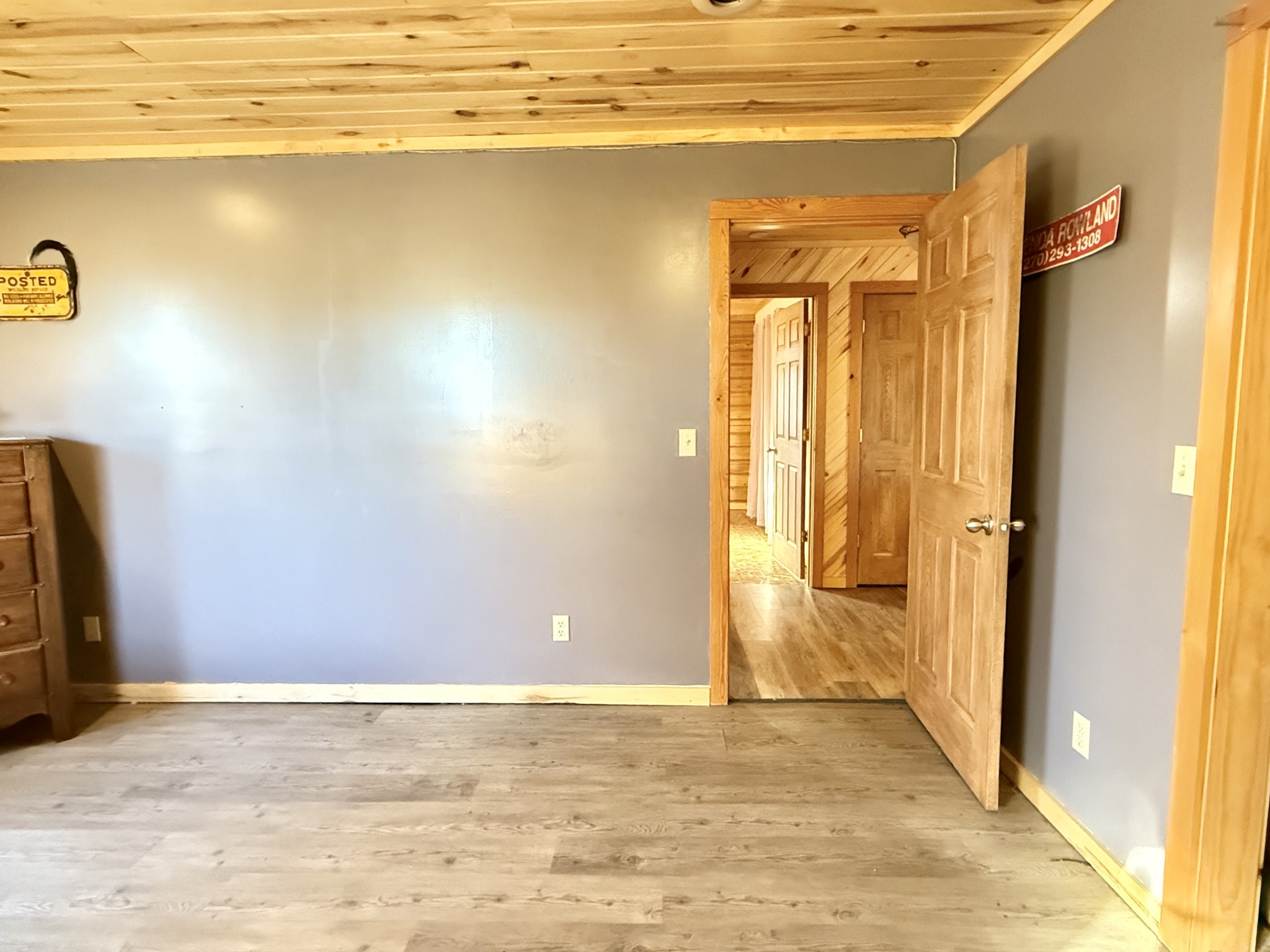 6843 Rabbit Creek Road Buchanan, TN 38222 - Photo 33 of 61 a view of a livingroom with wooden floor and a ceiling fan