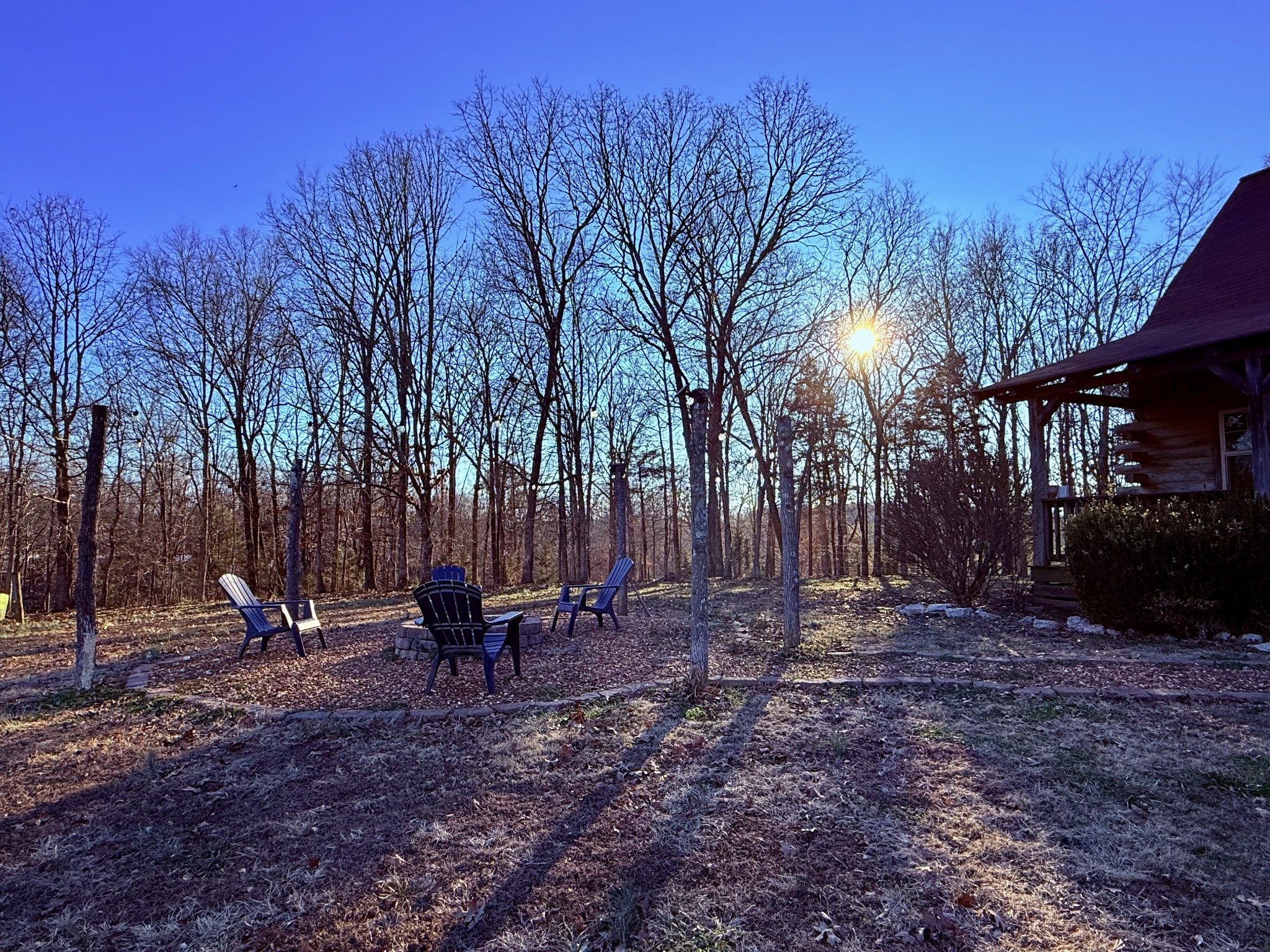 6843 Rabbit Creek Road Buchanan, TN 38222 - Photo 5 of 61 a backyard of a house with table and chairs