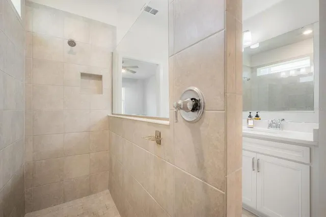a bathroom with a shower and a sink