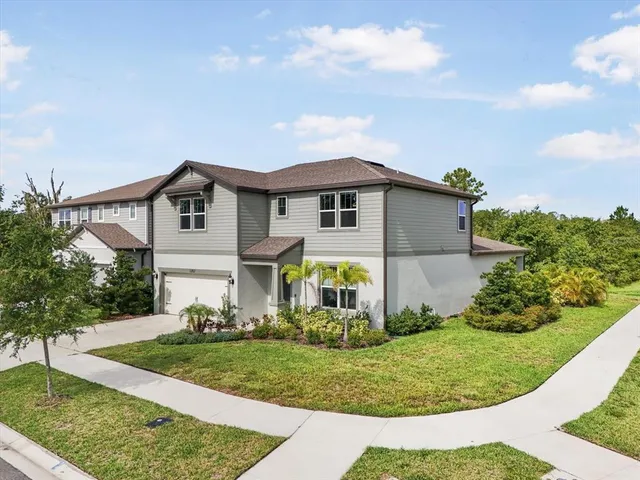 front view of a house with a yard