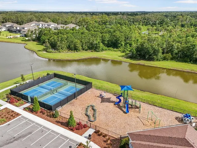 an aerial view of a house with a lake view