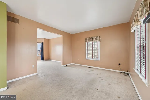 a kitchen with stainless steel appliances granite countertop a refrigerator a stove top oven a sink and dishwasher