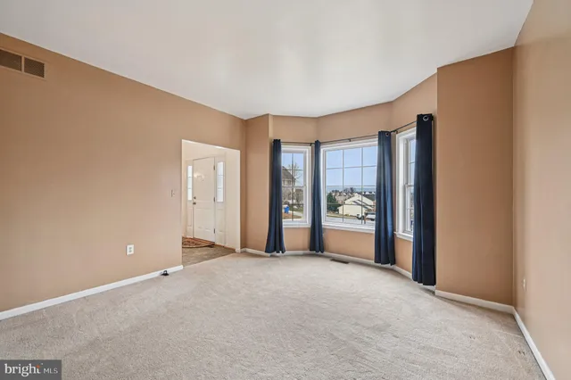 a view of a hallway with entryway door