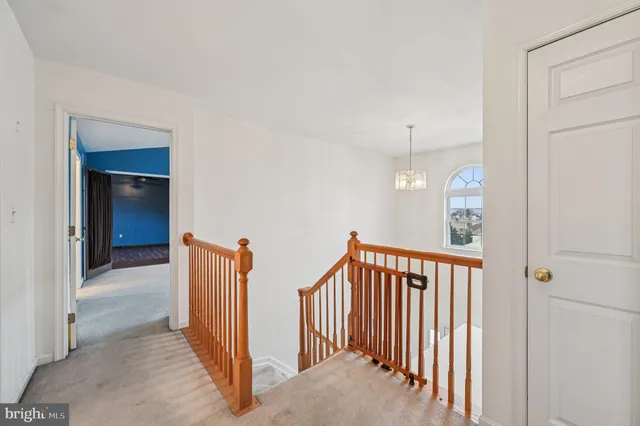 a view of an empty room with wooden walls